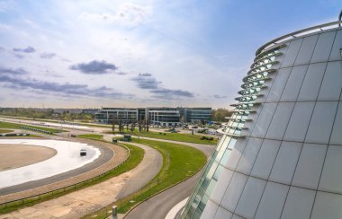 Weybridge,UK-April 4, 2019: Drifting track at Mercedes-Benz World. It is owned and operated by the German car manufacturer Mercedes-Benz and opened on 29 October 2006 clipart