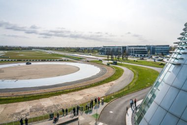 Weybridge,UK-April 4, 2019: Drifting track at Mercedes-Benz World. It is owned and operated by the German car manufacturer Mercedes-Benz and opened on 29 October 2006 clipart