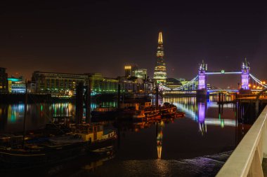 Famous Tower Bridge at night with light reflections, London, England clipart