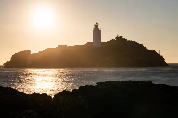 stock image Godrevy lighthouse at sunset in Cornwall. United Kingdom