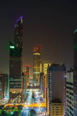 Aerial view of Abu Dhabi downtown at night, UAE clipart