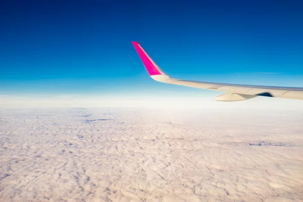 stock image Plane wing above the clouds - holiday concept