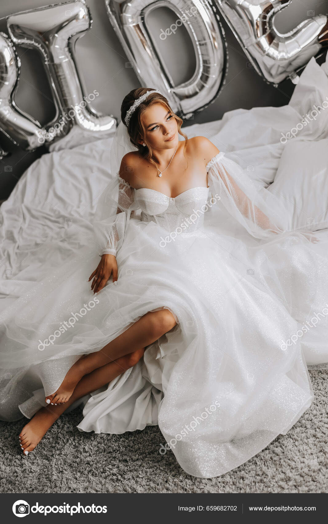 Gorgeous bride in white strapless a-line dress poses inside Las Vegas venue
