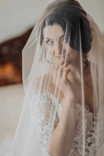 Portrait Brunette Bride White Dress Wrapped Veil Looks Touches Her — Stock Photo, Image
