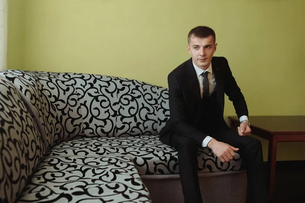 Portrait Man White Shirt Gray Pants Sitting Sofa Next Elegant — Stock Photo, Image
