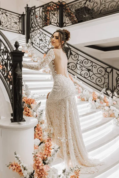 Girl Luxurious Wedding Dress Open Shoulders Stairs Decorated Flowers Horizontal — Stock Photo, Image