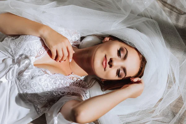 Beautiful Young Bride White Robe Poses Photographer Lying Floor Veil — Stock Photo, Image