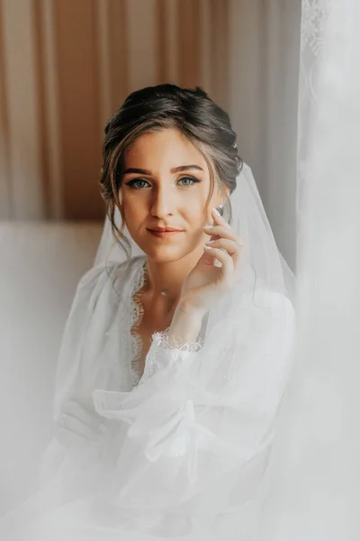Stunning Young Bride Poses Window Holding Her Veil Her Hands — Stock Photo, Image