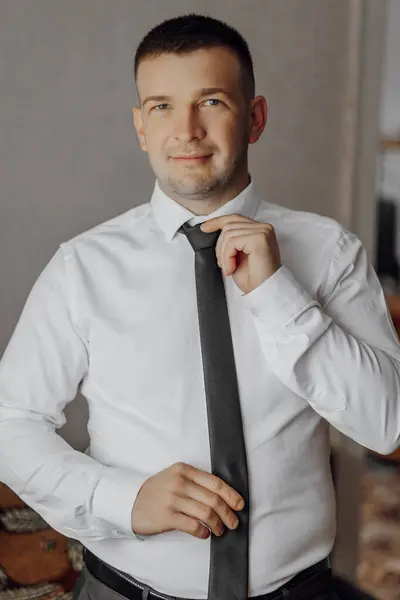 Man White Shirt Poses Adjusts His Black Tie Portrait Groom — Stock Photo, Image