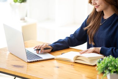 Successful happy smiling businesswoman saleswoman working on laptop computer, Young female making on video conference meeting online zoom, Accounting woman do taxes calculation interest rates law firm