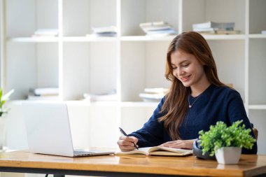 Successful happy smiling businesswoman saleswoman working on laptop computer, Young female making on video conference meeting online zoom, Accounting woman do taxes calculation interest rates law firm