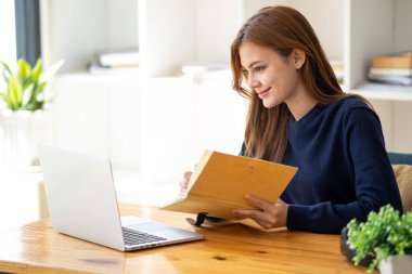 Successful happy smiling businesswoman saleswoman working on laptop computer, Young female making on video conference meeting online zoom, Accounting woman do taxes calculation interest rates law firm