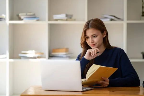 Successful happy smiling businesswoman saleswoman working on laptop computer, Young female making on video conference meeting online zoom, Accounting woman do taxes calculation interest rates law firm