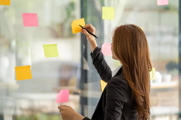 Happy Businesswoman Planning Ideas Project Work Glass Wall Colorful Memo — Stockfoto