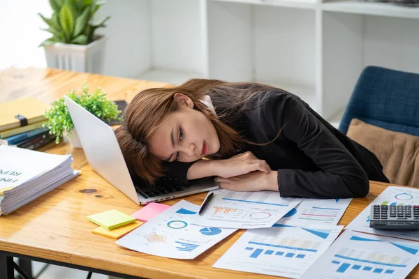 Tired bored exhausted stressed fatigue overwork businesswoman sleeping on tale in office, Burn out saleswoman sleeping in office