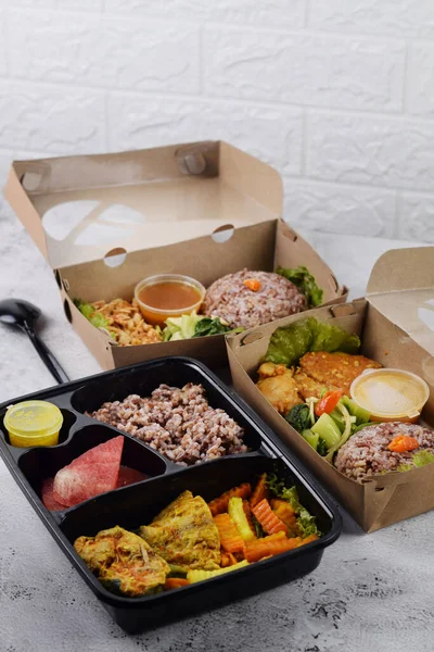 stock image kinds of brown rice and vegetables, healthy lunch box.