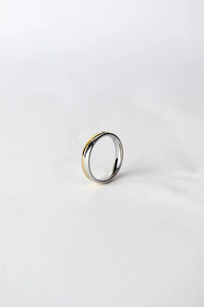 stock image silver and gold wedding ring isolated on white background