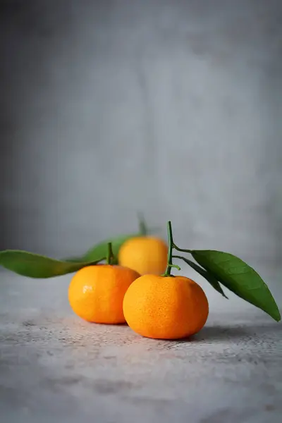 Fresh orange fruits. mandarin orange fruits on grey and texture background