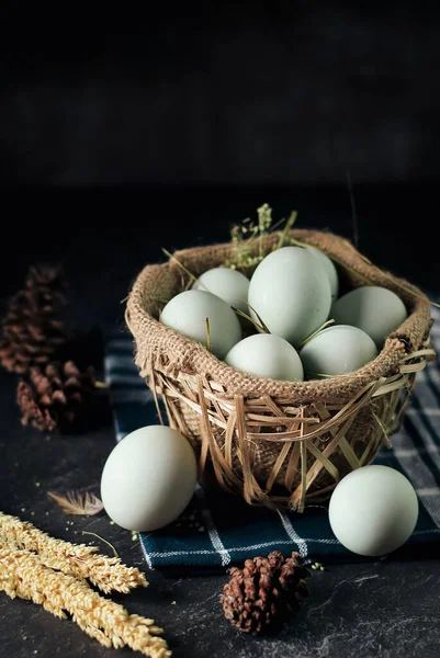 salted eggs, duck eggs in the bamboo basket and sackcloth with dark background