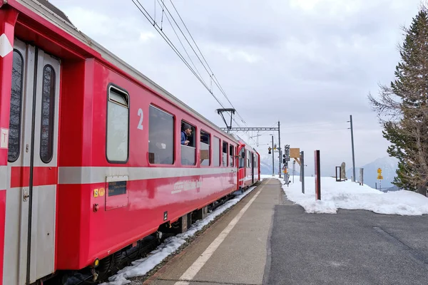 stock image The famous Swiss mountain train of Bernina Express crossed italian and swiss Alps in a blue sky