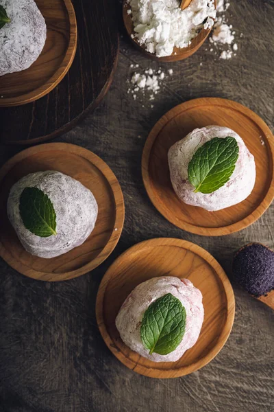 stock image Japanese mochi or rice cake filled with red bean and strawberry, mint leaves on top. Japan traditional rice cake.