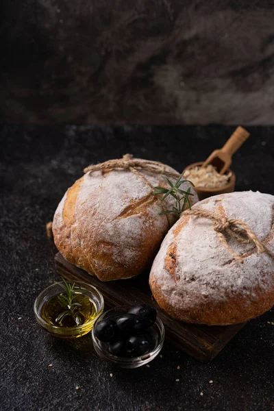 Freshly Baked Sourdough Ciabatta Bread Olives Rosemary Black Rustic Table — Stock Photo, Image