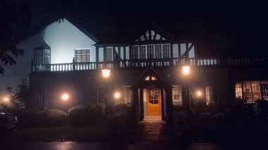 Worsley Marriott restaurant entrance with Tudor design in Worsley, Manchester England during night landscape photo clipart