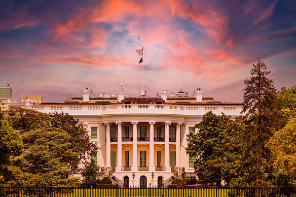The White House viewed from the South Lawn with a magnificent sunset sky