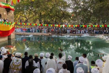 Ethiopian crowd at Timkat festival at Fasilides Bath in Gondar, Ethiopia clipart
