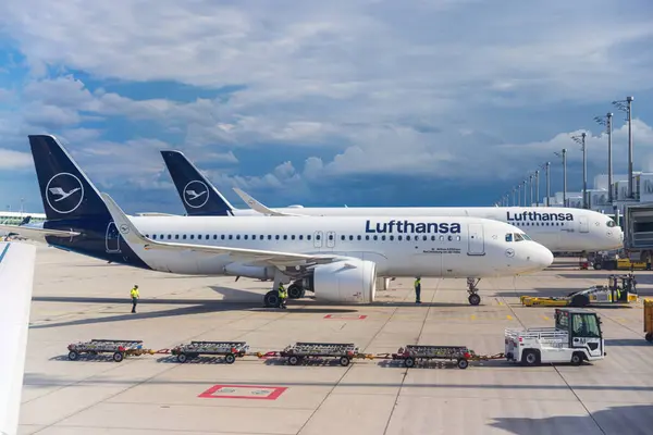 stock image Two Lufthansa airbus airplanes parked on Munich airport