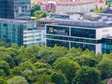 Aerial footage of the modern Microsoft headquarters in Munich, showcasing the contemporary office architecture and urban surroundings.