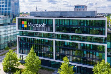 Aerial footage of the modern Microsoft headquarters in Munich, showcasing the contemporary office architecture and urban surroundings.