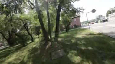 This is a peaceful walk through a quiet neighborhood. The video is taken from the perspective of a person walking down the street. The neighborhood is clean and well-maintained, with a variety of