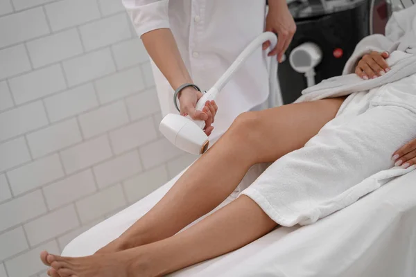 stock image Hair removing procedure of legs. Laser epilation and cosmetology in beauty salon. High quality photo