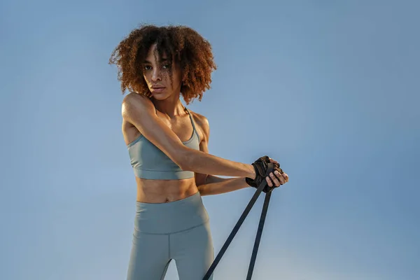 Woman Performs Exercises Expander Studio Background Strength Motivation — Foto de Stock