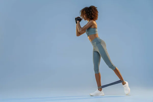 Athletic Woman Trains Legs Fitness Elastic Band Studio Background High — Stockfoto