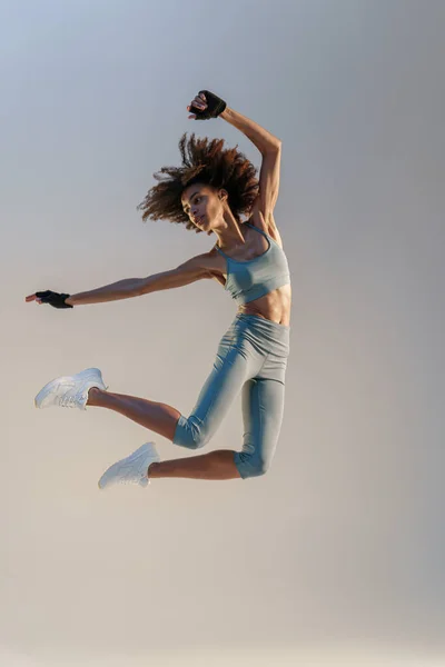 Athletic Active Woman Jumping Studio Background Dynamic Movement — Photo