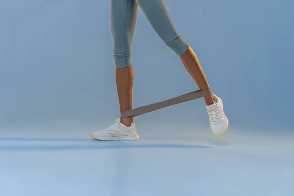 Athletic Woman Trains Legs Fitness Elastic Band Studio Background High — Stockfoto