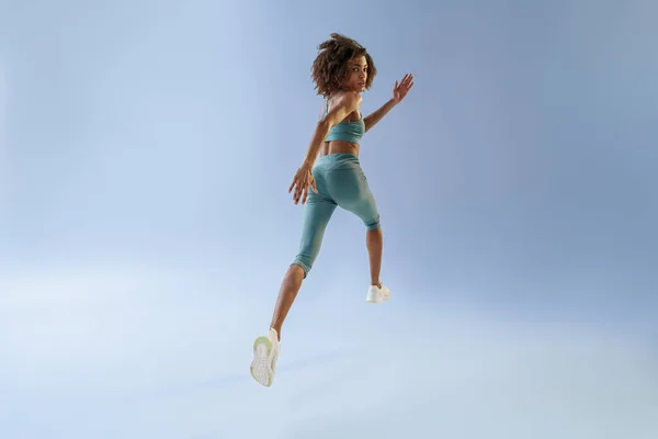 Athletic Active Woman Jumping Studio Background Dynamic Movement — 图库照片