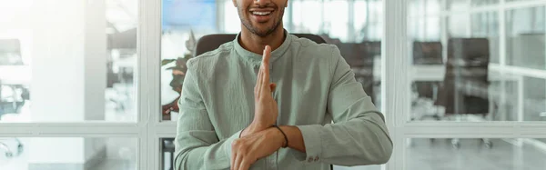 stock image Businessman using sign language while talking online with client in office. High quality photo