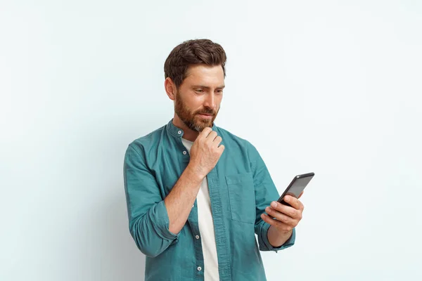 Man Looking His Mobile Phone While Standing White Background High — Stock Photo, Image