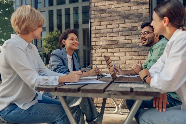 stock image Group of office workers working on the terrace of the office. Teamwork concept . High quality photo