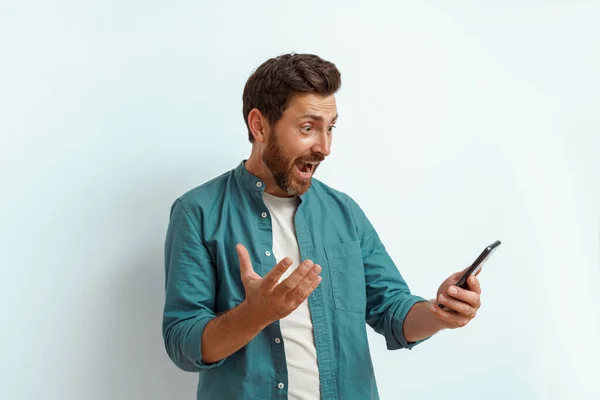 Man Showing Happy Gesture While Looking His Mobile Phone White — Stock Photo, Image
