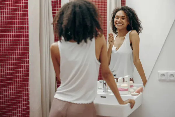 Positive Woman Brushing Teeth Toothbrush Standing Mirror Bathroom Oral Hygiene — Stock Photo, Image