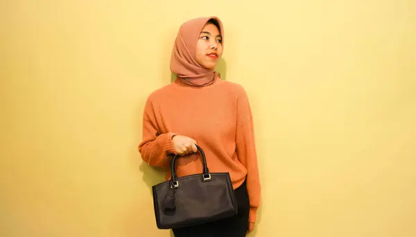 Happy Asian Girl Woman Holding Black Bag Standing Orange Background — Fotografia de Stock