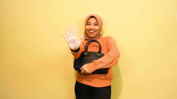 Happy Asian Girl Woman Holding Black Bag Standing Orange Background — Stock Photo, Image