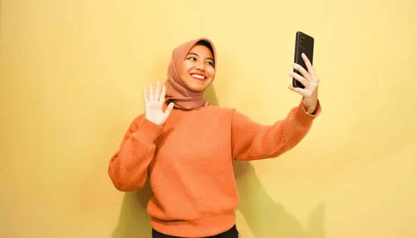 Young Beautiful Asian Woman Wearing Orange Sweater Use Smartphone Isolated — Stock Photo, Image