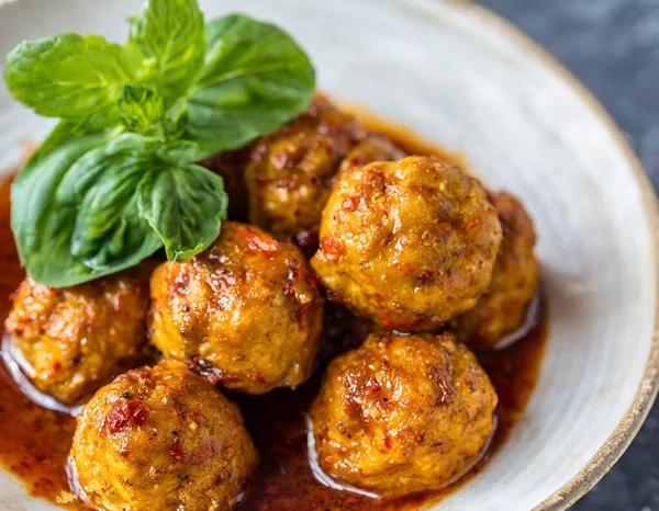 Fiery Tofu Meatballs - A Zesty Culinary Delight Captured in a Photography Studio.