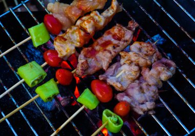 Grilling BBQ pork and chicken