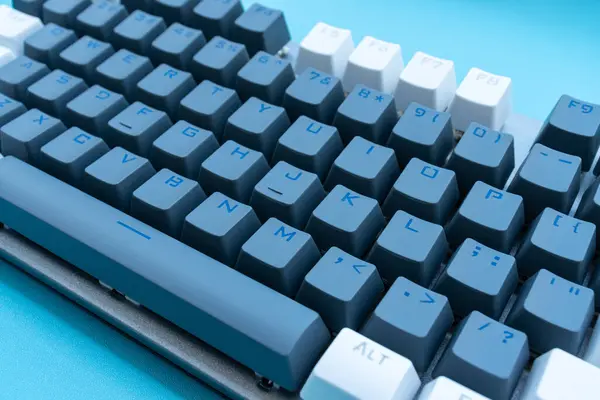 Mechanical keyboard isolated on blue background. After some edits.